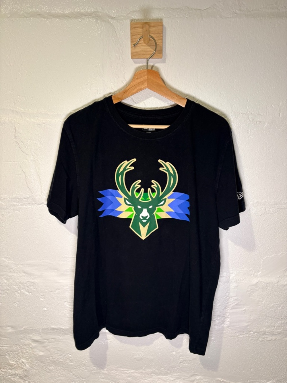 Milwaukee Bucks New Era Black T-Shirt with Blue and Green Deer Logo
